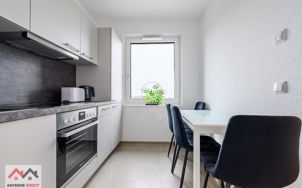 Dining area in the kitchen with a table and seating for guests