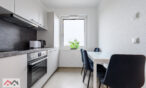Dining area in the kitchen with a table and seating for guests